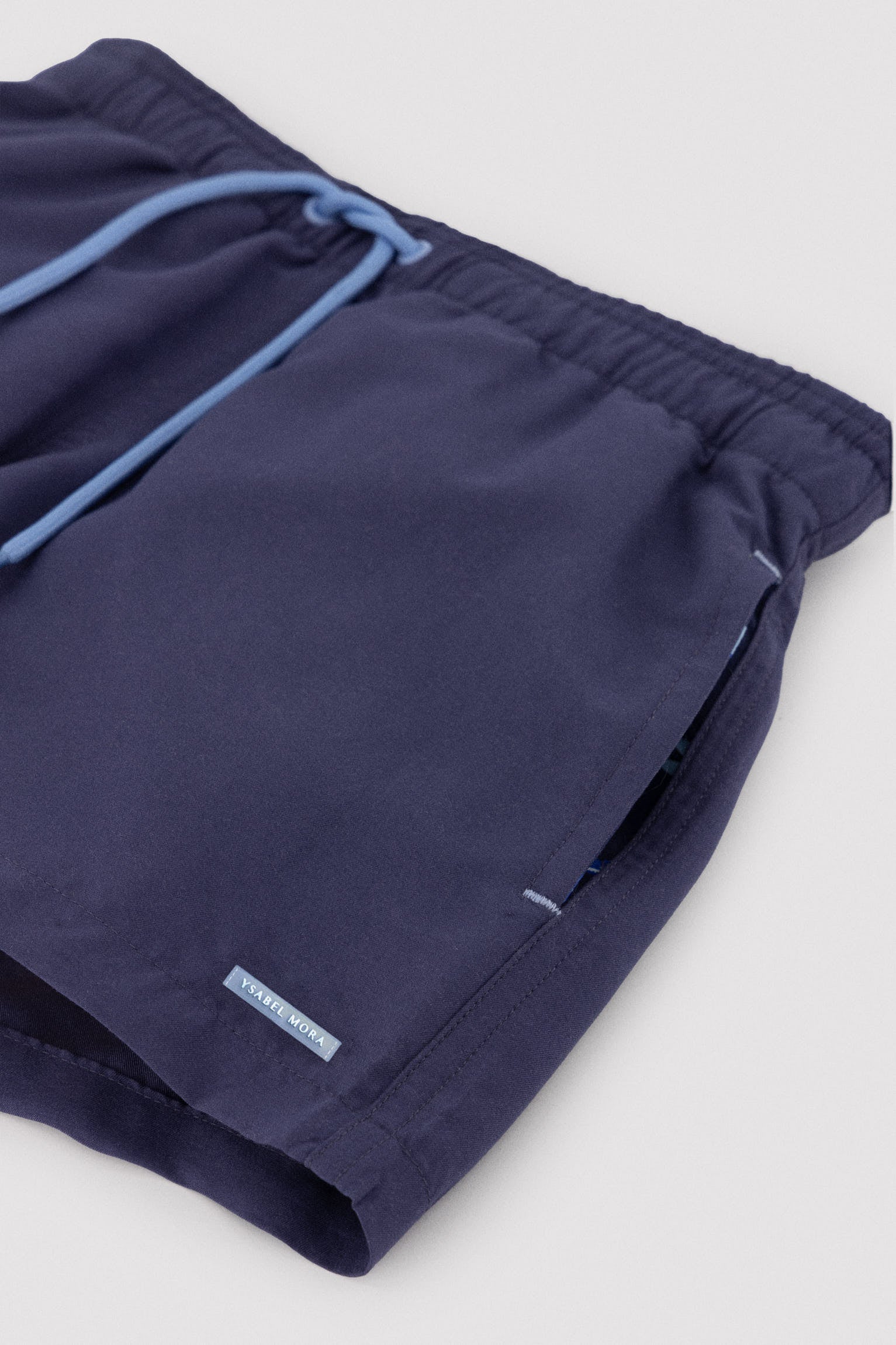 Boy's short swimming trunks with contrasting navy lining