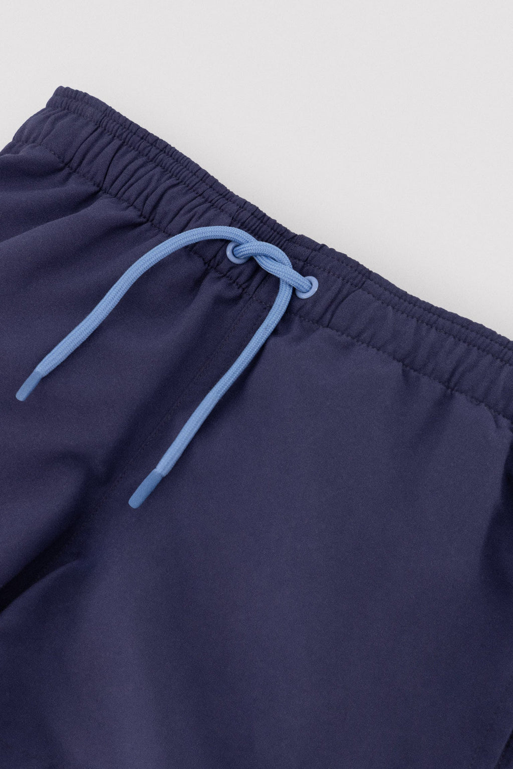 Boy's short swimming trunks with contrasting navy lining