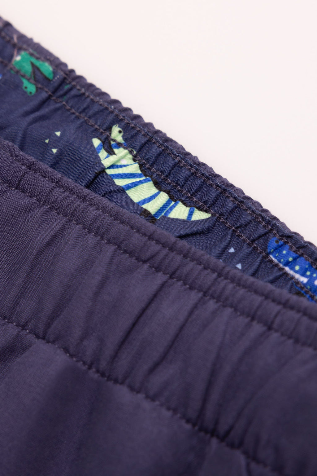 Boy's short swimming trunks with contrasting navy lining