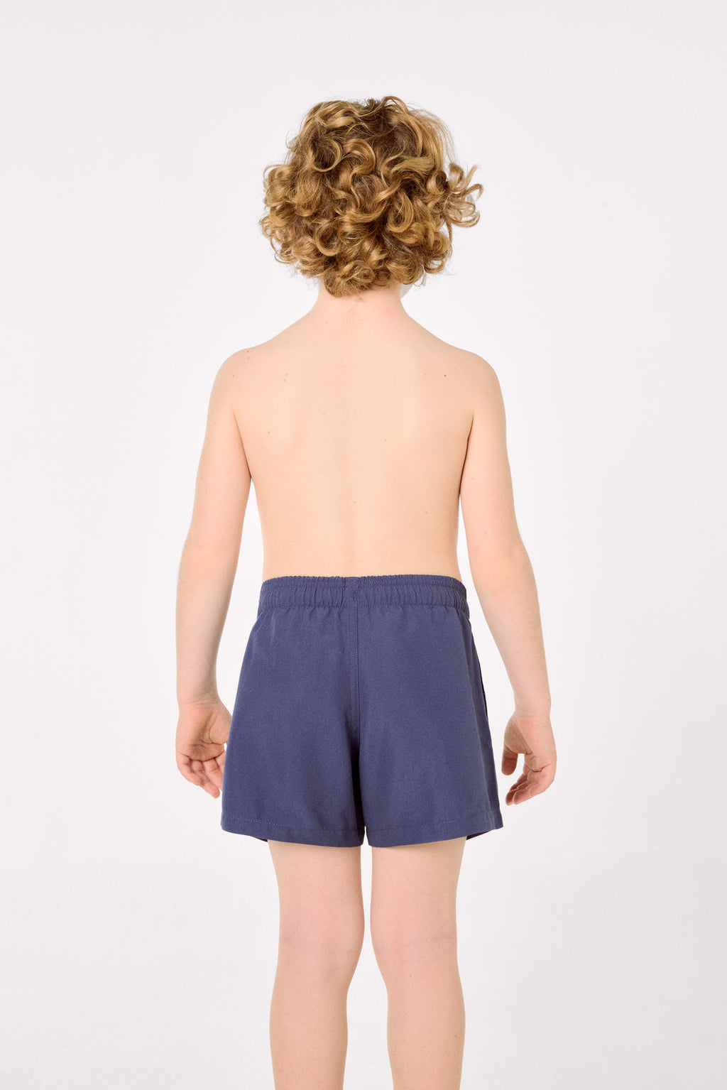 Boy's short swimming trunks with contrasting navy lining